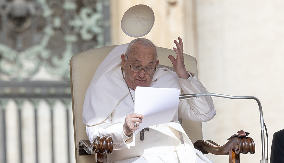 The wind blows away the Pope's skullcap