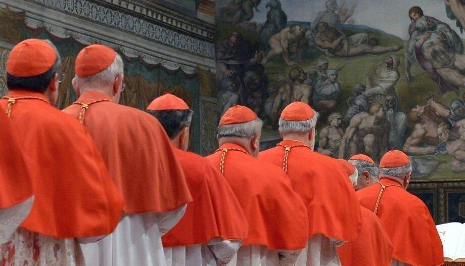Which saints do the cardinals invoke in the procession to the Sistine Chapel?