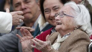Grandmother greets Pope Francis at the Vatican.
